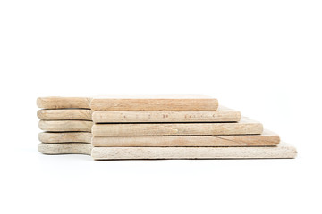 Set of used brown wooden cutting boards stack on each other isolated on white background.