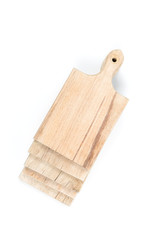 Set of used brown wooden cutting boards stack on each other on white background