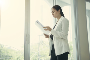 young businesswoman holding file document at office.