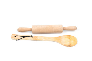 Big wooden stirring spoon and small rolling pin isolated on white background. Kitchen and cooking...