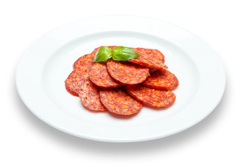 Italian Salami or spanish chorizo on plate white background