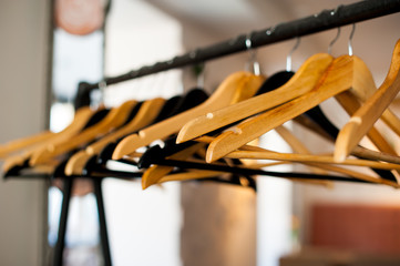 Wooden hangers on the rack.