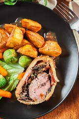 Pork tenderloin in wellington style in puff pastry