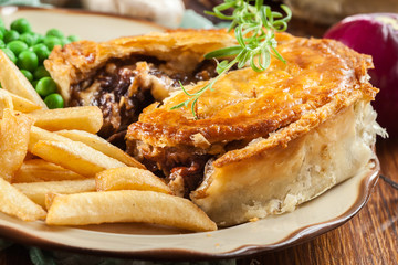 Homemade beef stew pie with french fries