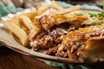 Homemade beef stew pie with french fries