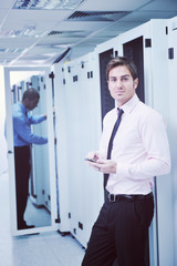 Fototapeta premium it engeneer talking by phone at network room