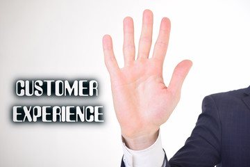 A businessman shows an inscription:CUSTOMER EXPERIENCE