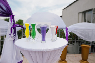 several containers with sand of different colors for a sand ceremony