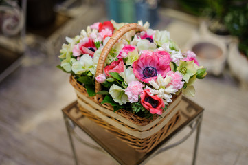 Beautiful brown vintage basket of pink and white flowers