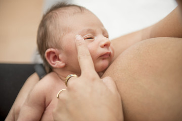 woman breastfeeding her baby