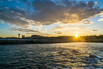 Naklejka premium View to the shore with beautiful sea and sunset
