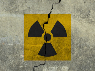 sign of radiation on a concrete wall background. 