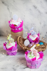 Easter composition with orthodox sweet bread, kulich and eggs on light background. Easter holidays breakfast concept with copy space.