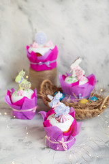 Easter composition with orthodox sweet bread, kulich and eggs on light background. Easter holidays breakfast concept with copy space.