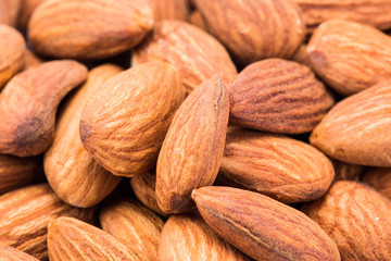 Close up of a pile of salted almonds, selective focus