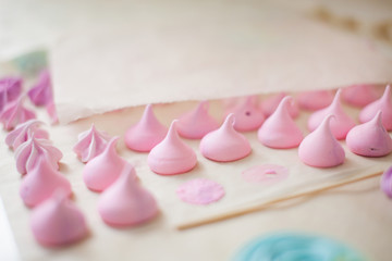 Closeup homemade multicolor meringue cookies. Cooking concept.
