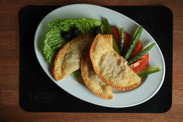 plate with cheburek and vegitables