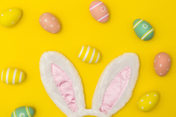 Easter holiday background with bunny ears and easter eggs