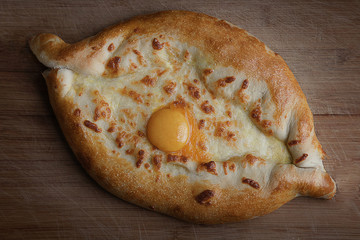 Tasty, juicy pizza with cheese and yolk. 