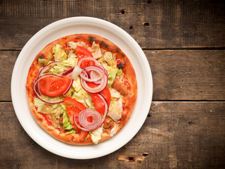 Tasty pizza with tuna on a rustic table