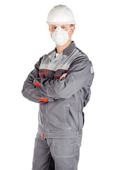 builder in white helmet and mask with crossed arms