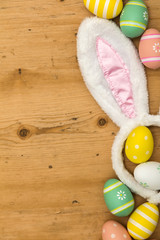 Easter holiday background with bunny ears and easter eggs