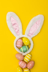 Easter holiday background with bunny ears and easter eggs