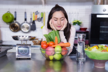 Fototapeta premium Portrait of young woman model with vegetable and fruit.