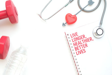 Sport equipments, stethoscope, water bottle and notebook on white background, Flat lay healthcare and Lifestyle concept