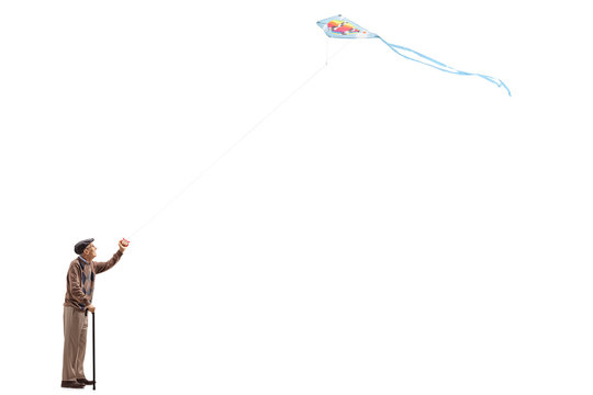 Elderly Man Flying A Kite