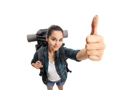 Female teen tourist making a thumb up sign