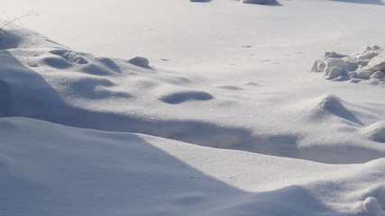 The texture of snow and shadows in the sun.