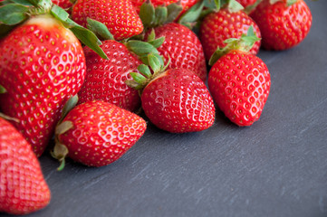 Fresh strawberries on a gray background with copy space