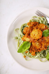 pasta with Bolognaise sauce and basil
