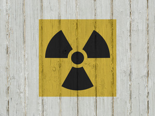 sign of radiation on a wooden background. 