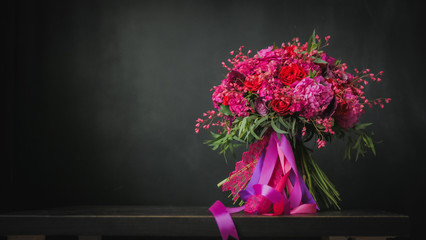 Beautiful wedding bouquet on the black background