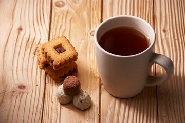 tee and cookies on a wooden table