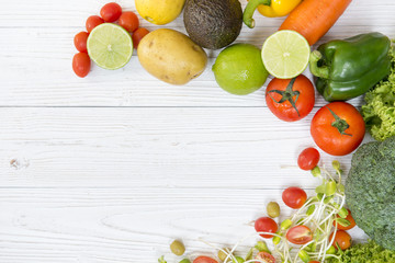 Selective focus variety of vegetables on white wooden background top view and copy space.