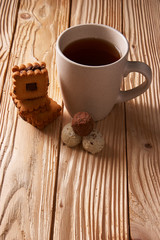 Cup of Tea with Cookies on wooden background