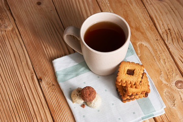 Cup of Tea with Cookies on wooden background