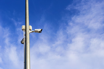 The security camera stuck on light poles for security in the communities.