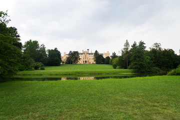 Castle pond with Lednice mansion in Lednice Valtice area, Moravia, Czech Republic, summer day