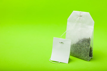 White tea bag with an empty tag. Copy space for text.