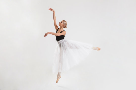Amazing young woman ballerina dancing