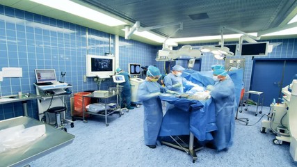 Timelapse Hospital Surgery team. Hospital surgery team operating a patient  - Powered by Adobe