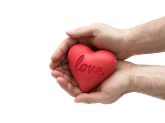 Obraz premium Red heart with imprinted love word in man's hands.