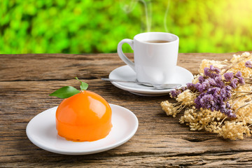 Orange cake on grunge wooden table