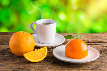 Orange cake on grunge wooden table