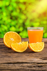 Glass of Fresh Orange Juice on grunge wooden table