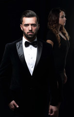 gentleman with his girl posing in the studio